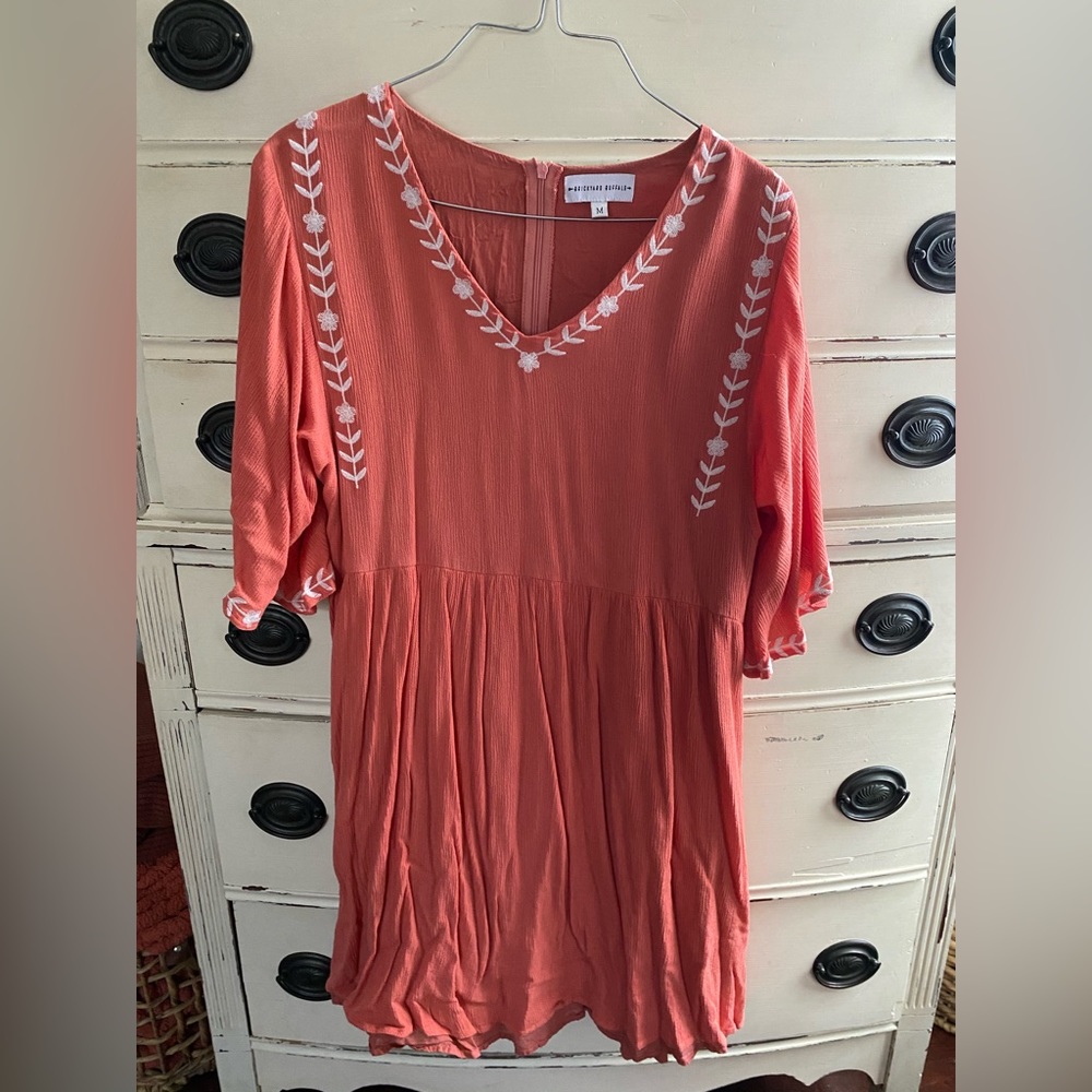 Peach colored dress, size medium.
